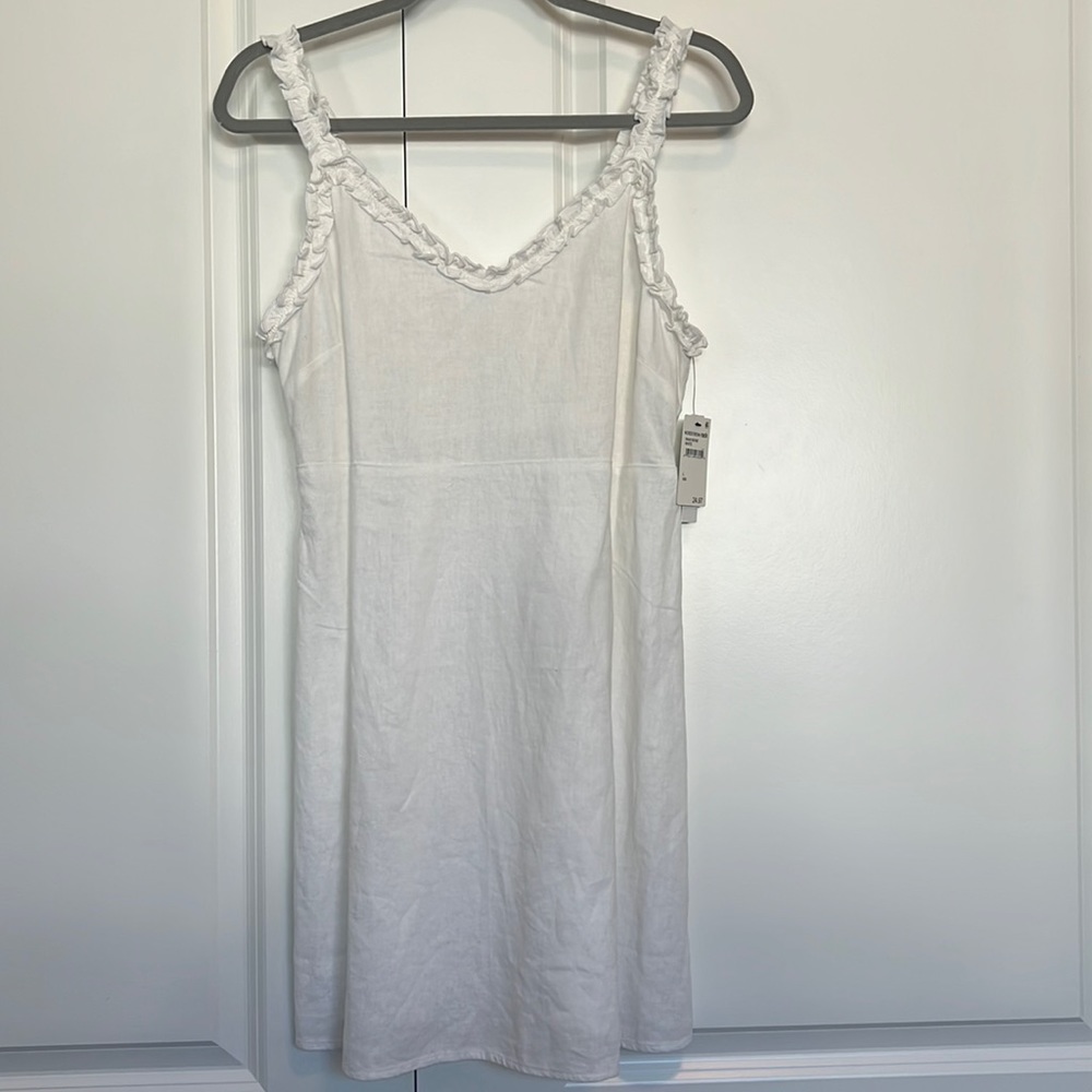 NWT. White abound dress. Ruffles and smocking in back. Size L